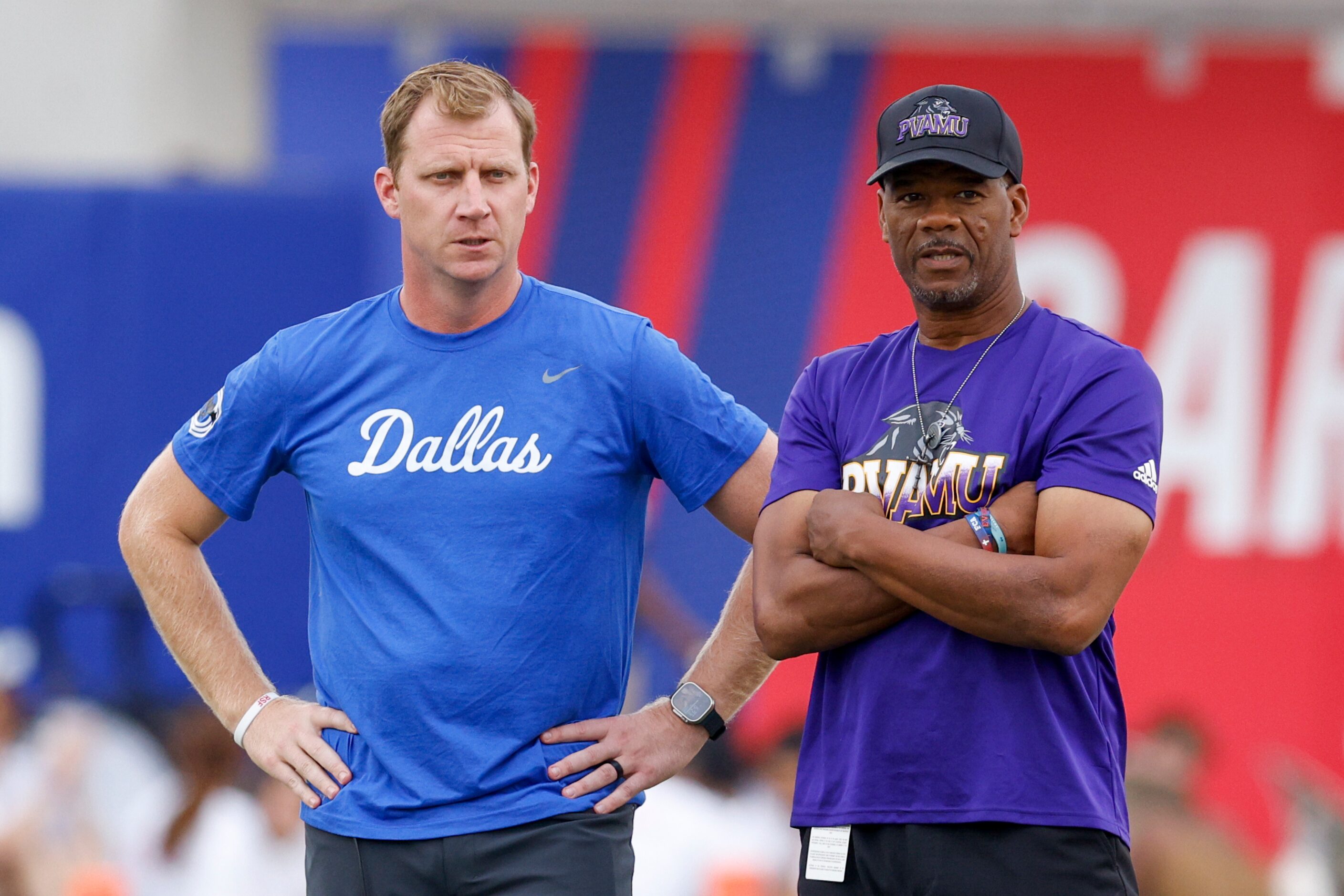 SMU head coach Rhett Lashlee talks with Prairie View A&M head coach Bubba McDowell before an...