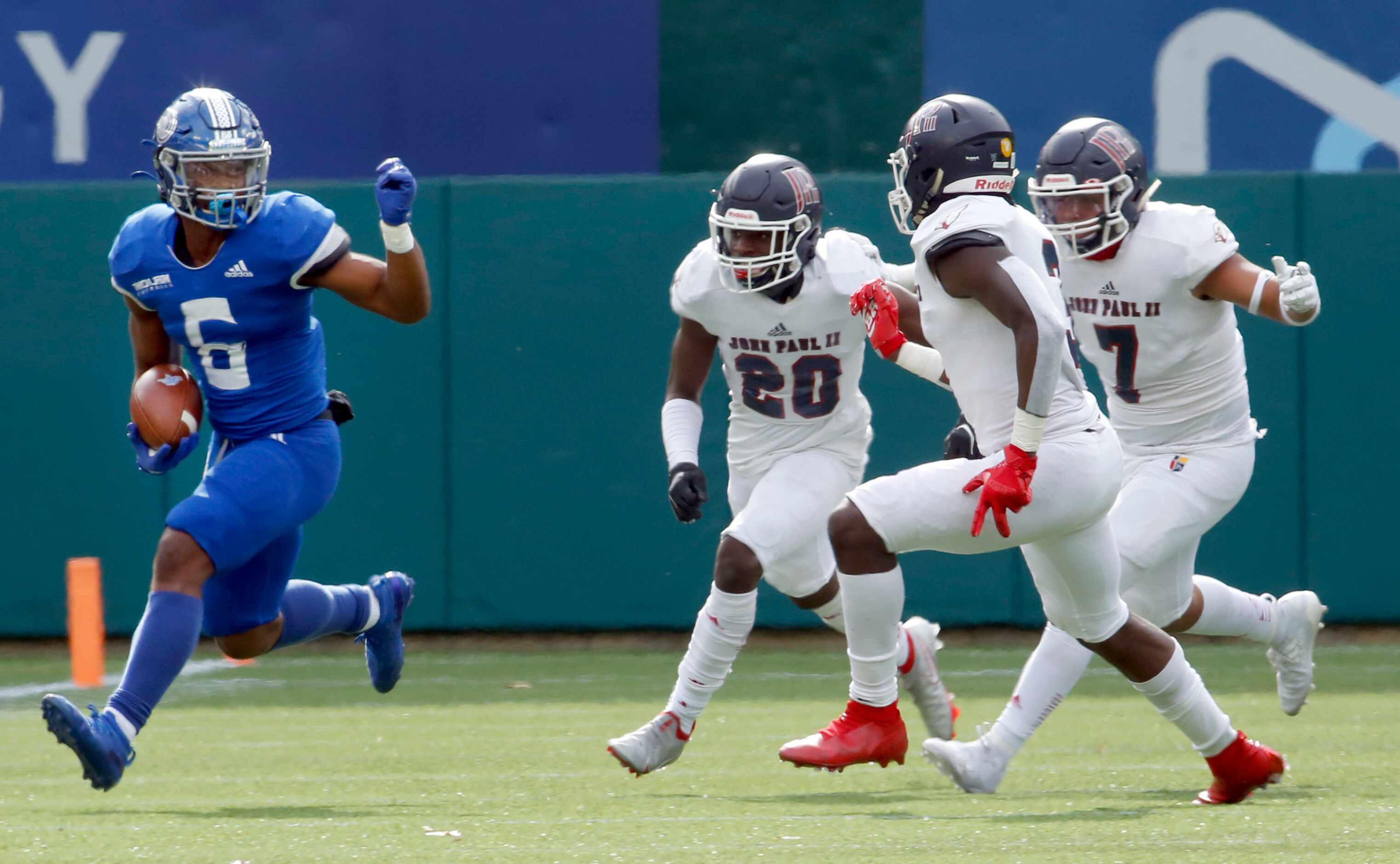 Fort Worth Nolan running back Emeka Megwa (6) tacks on yardage after a second quarter...