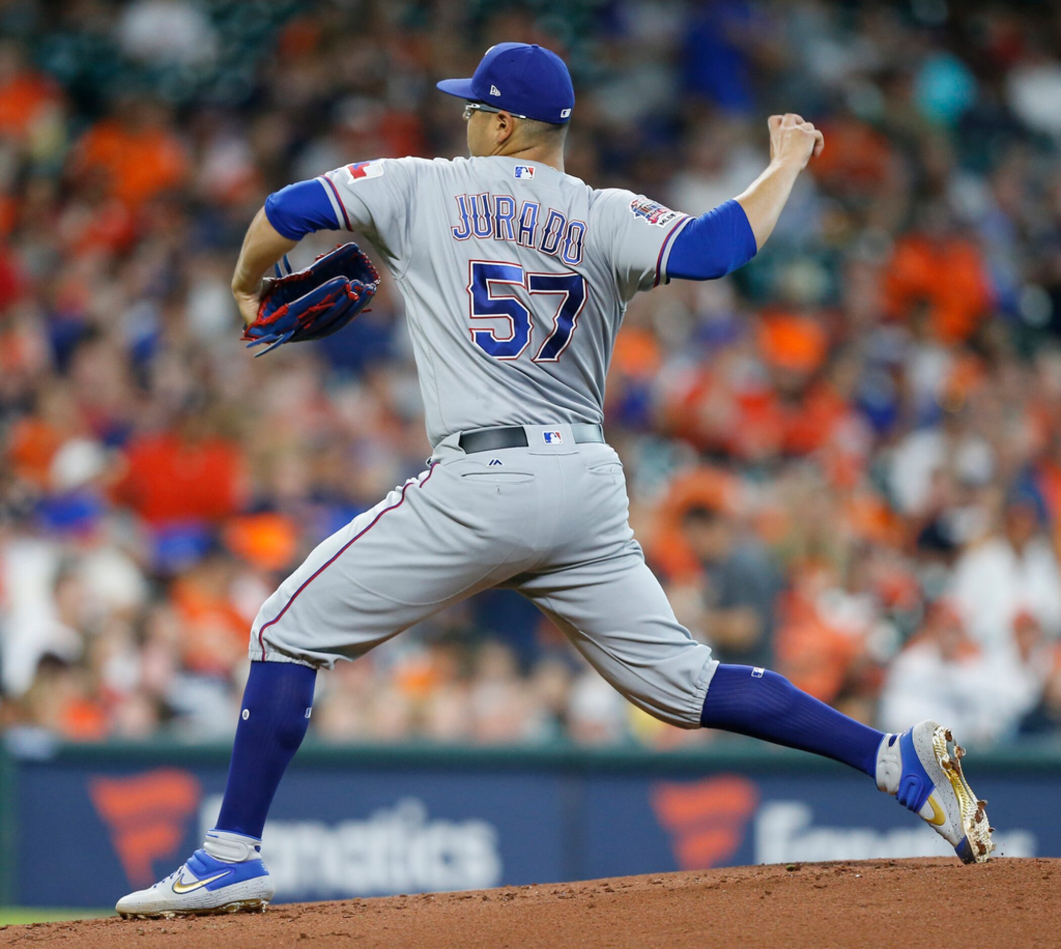 HOUSTON, TEXAS - JULY 20: Ariel Jurado #57 of the Texas Rangers pitches in the first inning...