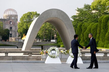 President Barack Obama, right, shakes hands with Japanese Prime Minister Shinzo Abe at...