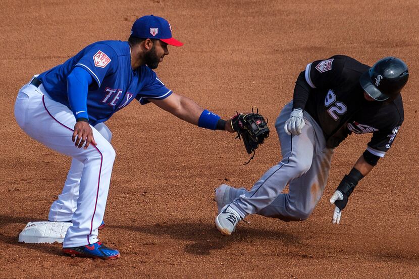 Chicago White Sox second baseman Nick Madrigal is caught stealing as Texas Rangers shortstop...