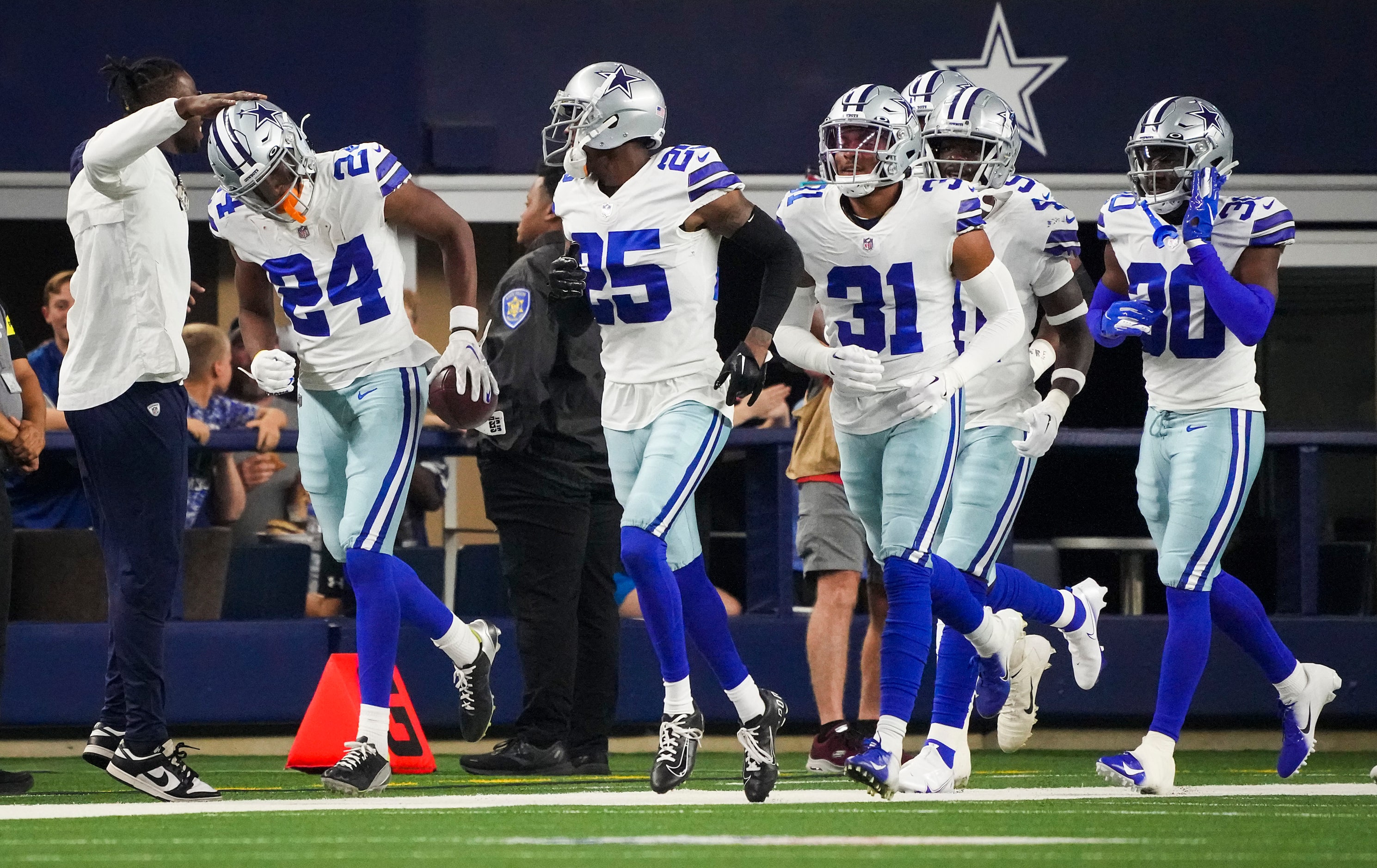 Dallas Cowboys safety Israel Mukuamu (24) celebrates after intercepting a Seattle Seahawks...