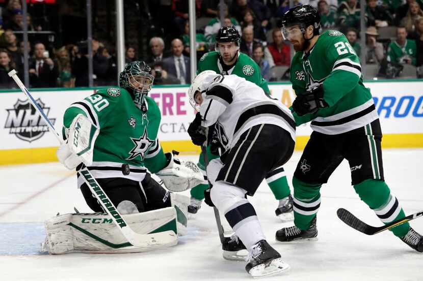 Dallas Stars goalie Ben Bishop (30) keeps his eyes trained on an airborne puck in front of...