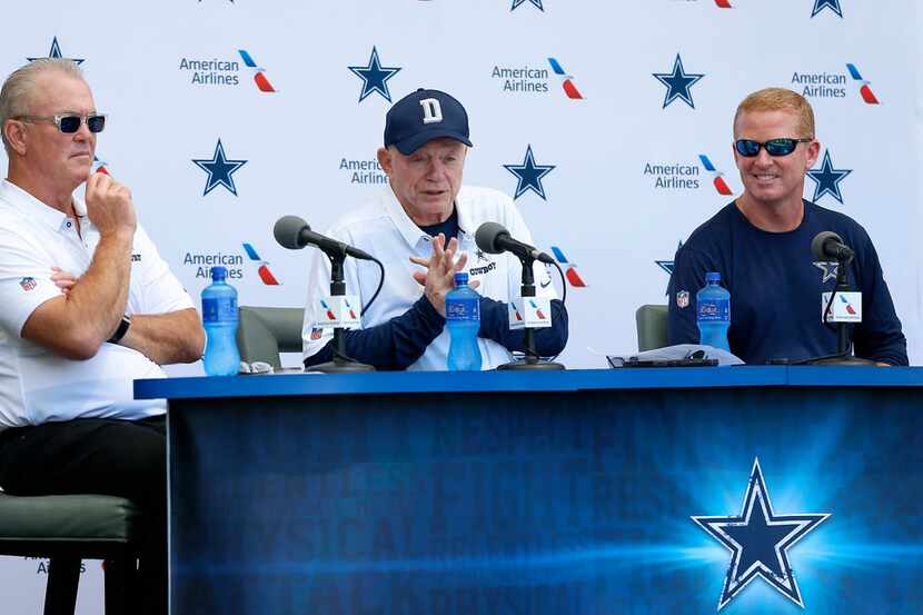 Cowboys owner Jerry Jones, center, speaks as head coach Jason Garrett, right, and executive...