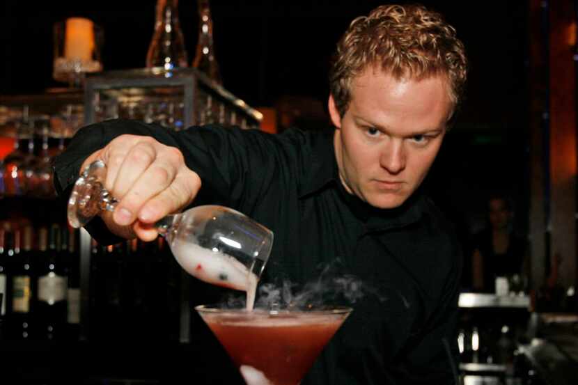  Kevin Masterson makes a Berries and Bubbles Martini at The Ocean Prime's Blu Lounge.