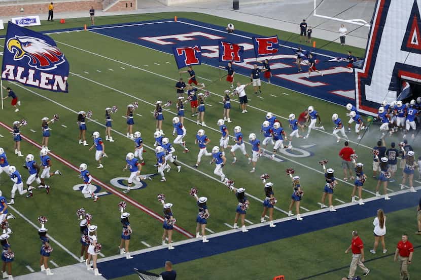 Allen players take the field against Evangel Christian Academy at Eagle Stadium in in 2016.