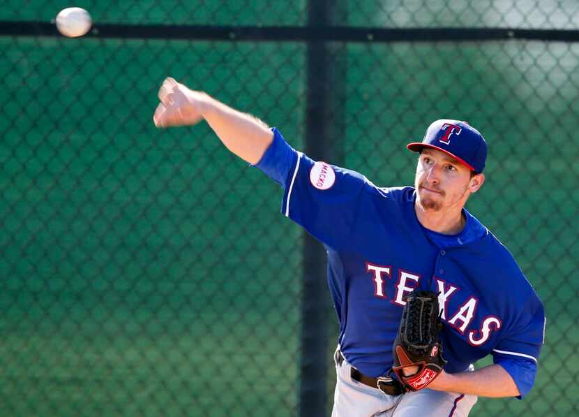 Feb 24, 2015; Surprise, AZ, USA; Texas Rangers starting pitcher Tanner Scheppers (52) throws...