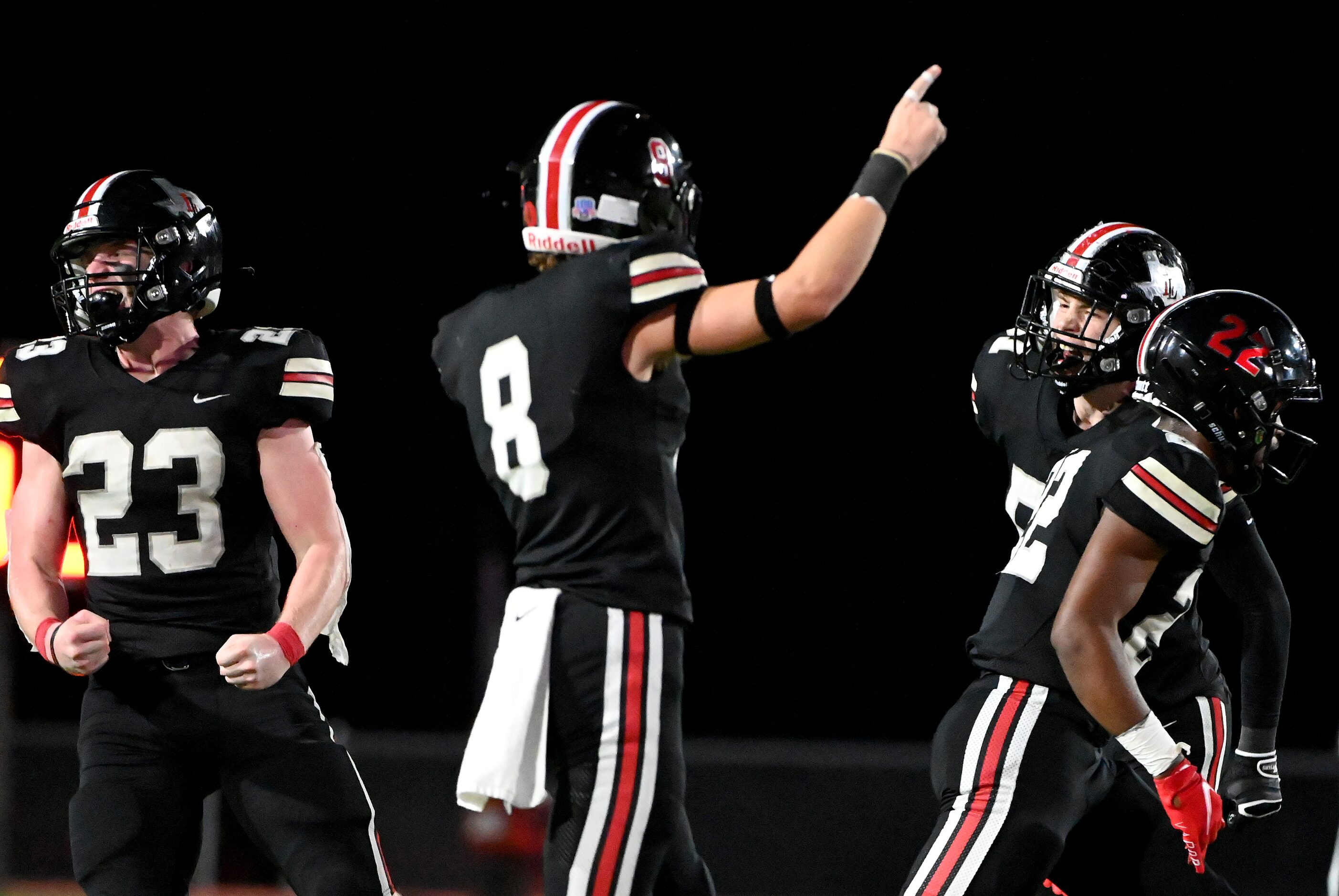 Lovejoy’s Dillon Magee (23),  Adam Eschler (8), Roderick Mapps (22) and Zach Bahner (51)...