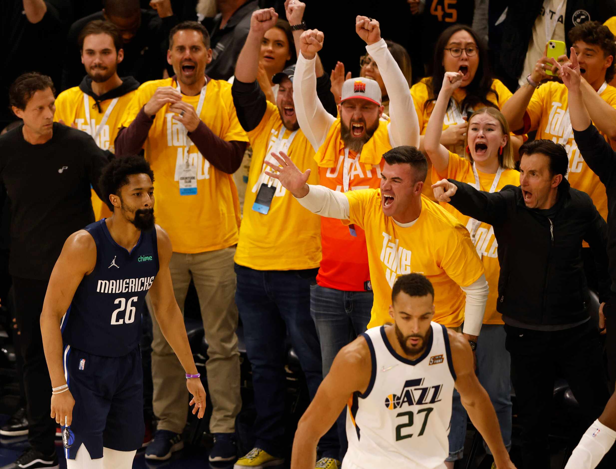 Utah Jazz fans celebrate after Dallas Mavericks guard Spencer Dinwiddie (26) misses a last...
