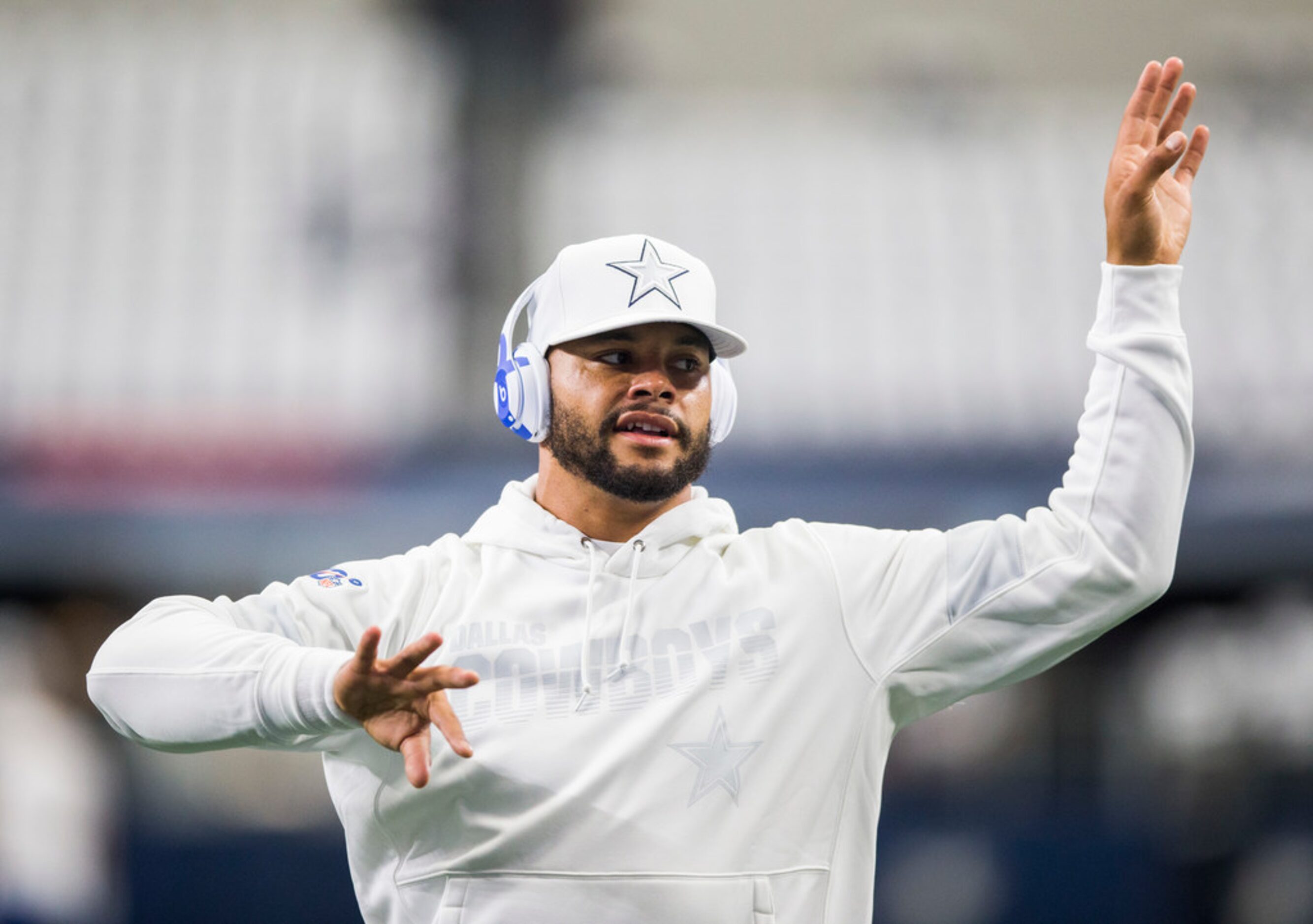 Dallas Cowboys quarterback Dak Prescott (4) warms up before an NFL game between the New York...