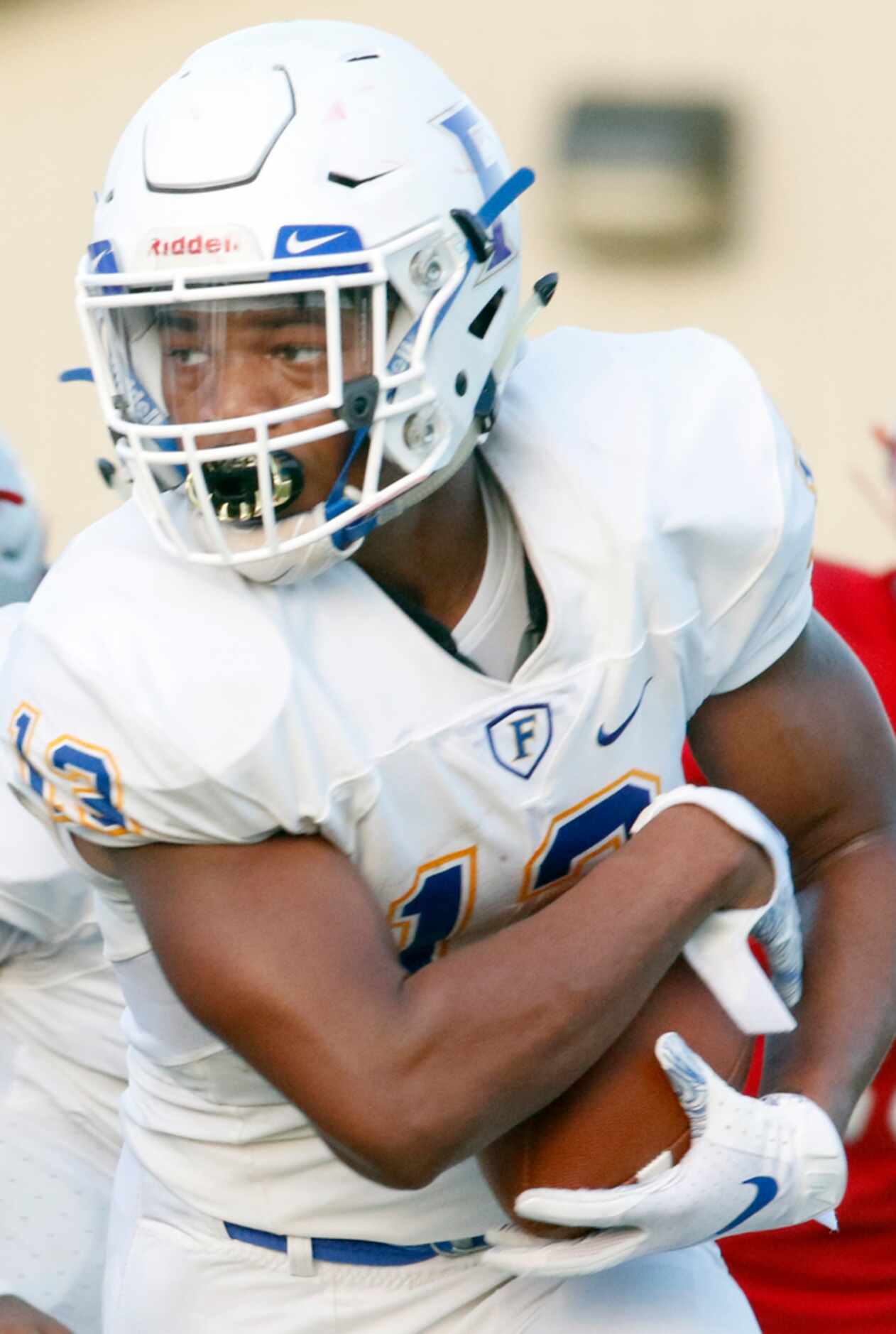 Frisco running back Blake May (13) follows his blocks during first half action against...