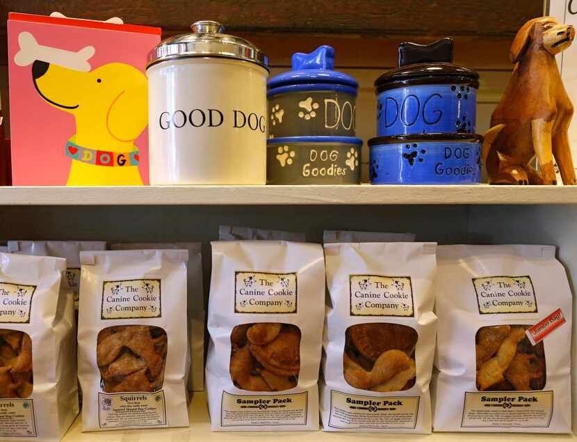
A few of the dog treats sit on shelves at The Canine Cookie Company. The shop is open...