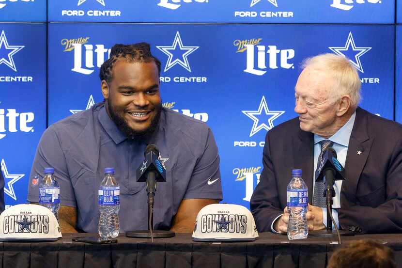 Dallas Cowboys rookie defensive tackle Mazi Smith smiles as he answers a question next to...