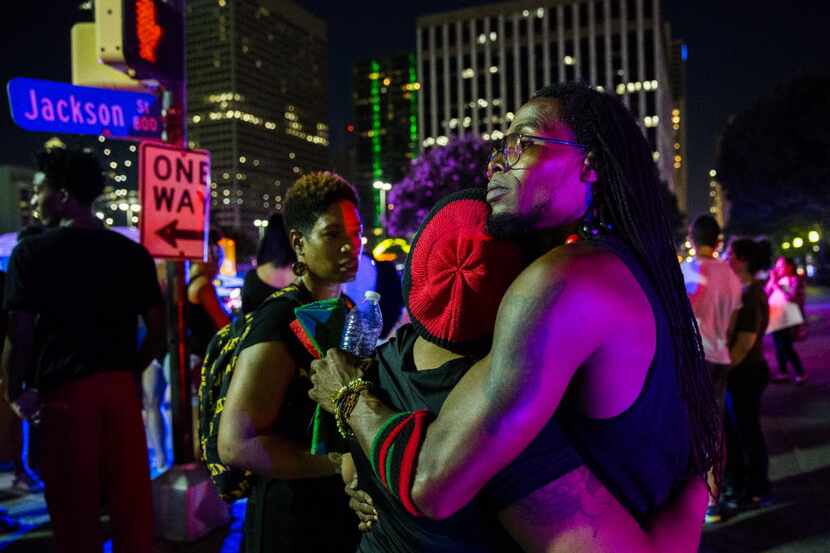 Protestors react after gunmen shot 11 people during a Black Lives Matter protest on...