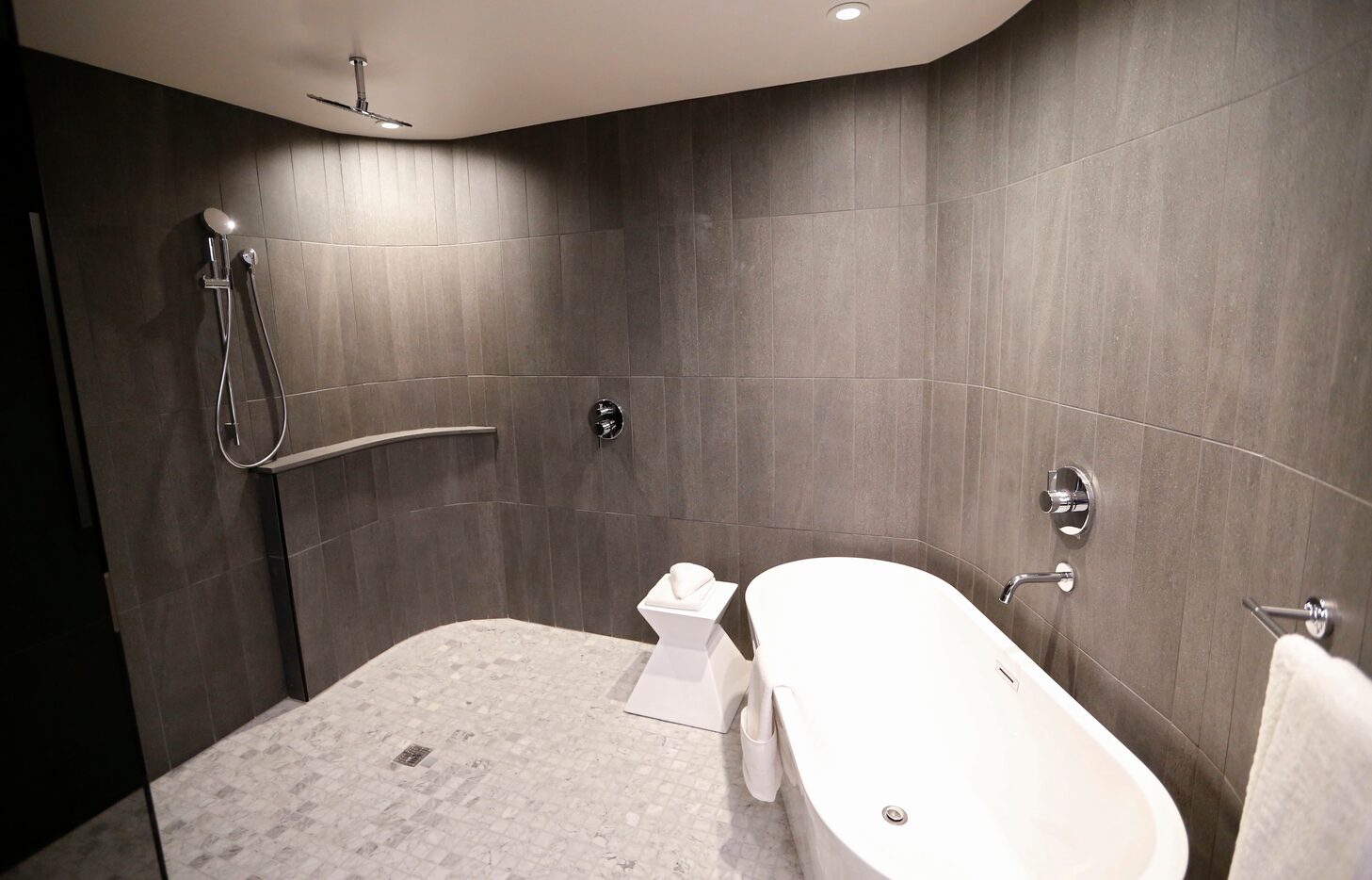 A view of the shower and tub in a room during a tour of the Statler Hotel in Dallas.