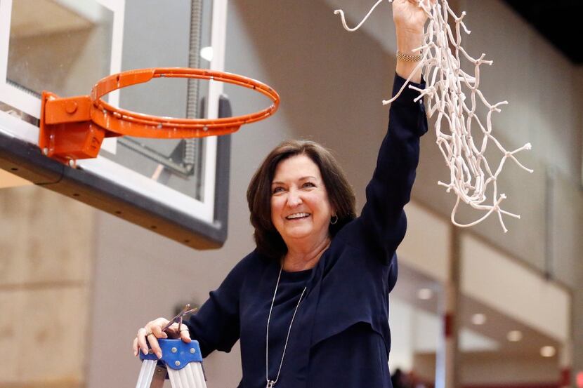 Duncanville girls basketball coach Cathy Self-Morgan celebrated her team's 62-49 win over...