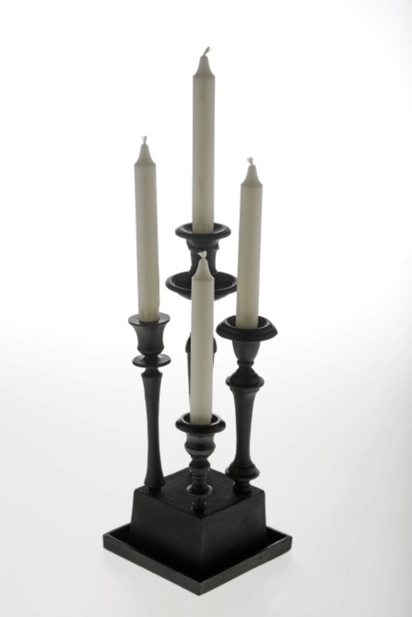 A black-metal, four-branch candelabrum of Dutch design takes a modern turn, especially when...