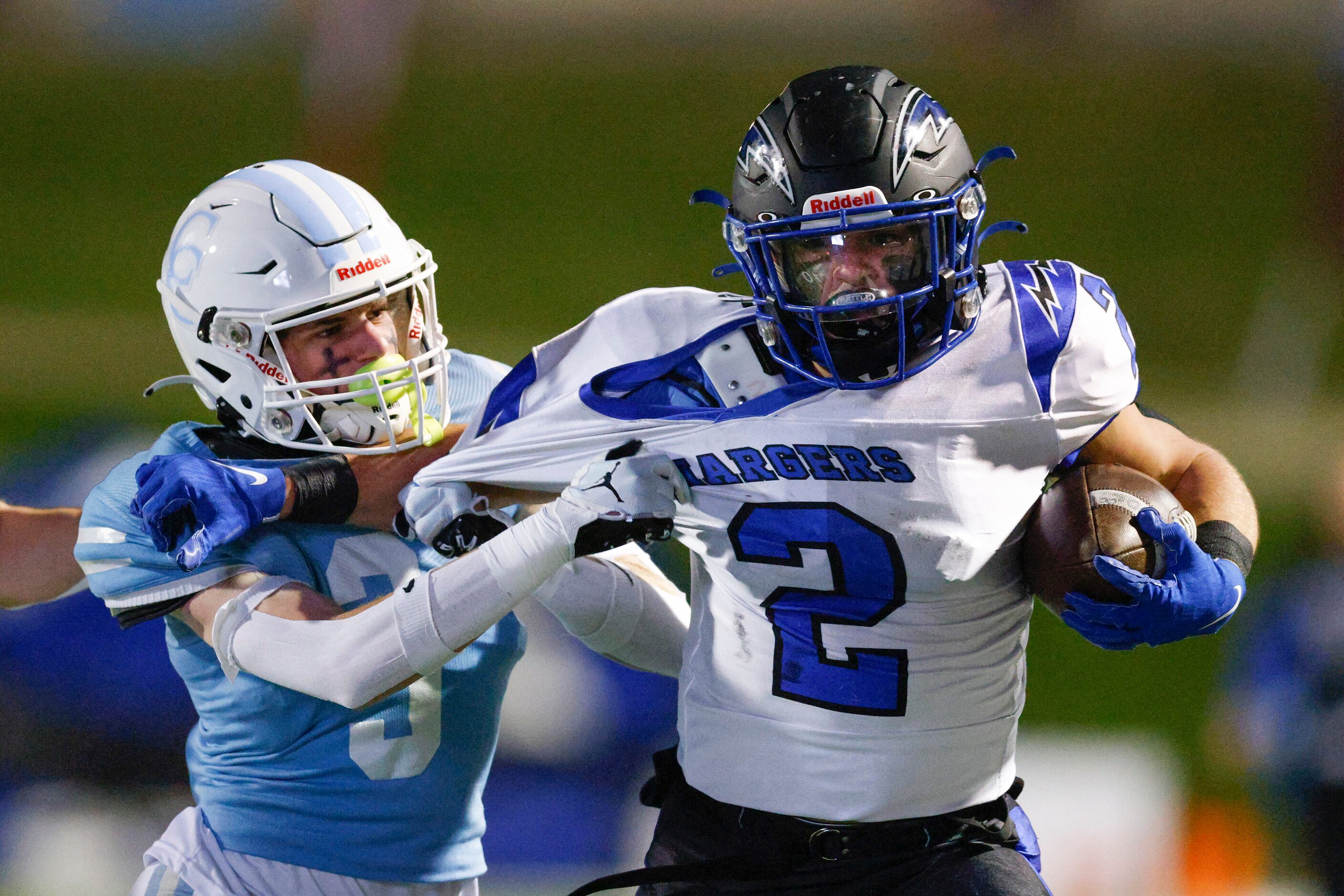 Houston Cypress Christian defensive back Andrew Mestayer (3) pulls the jersey of Dallas...