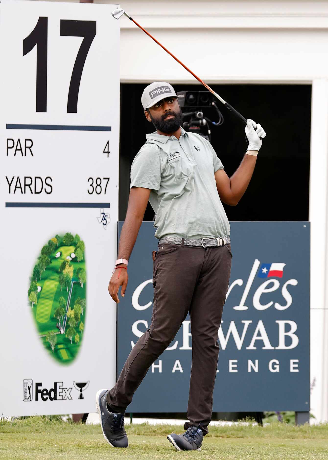 Professional golfer Sahith Theegala watches his tee shot off No. 17 during round one of the...