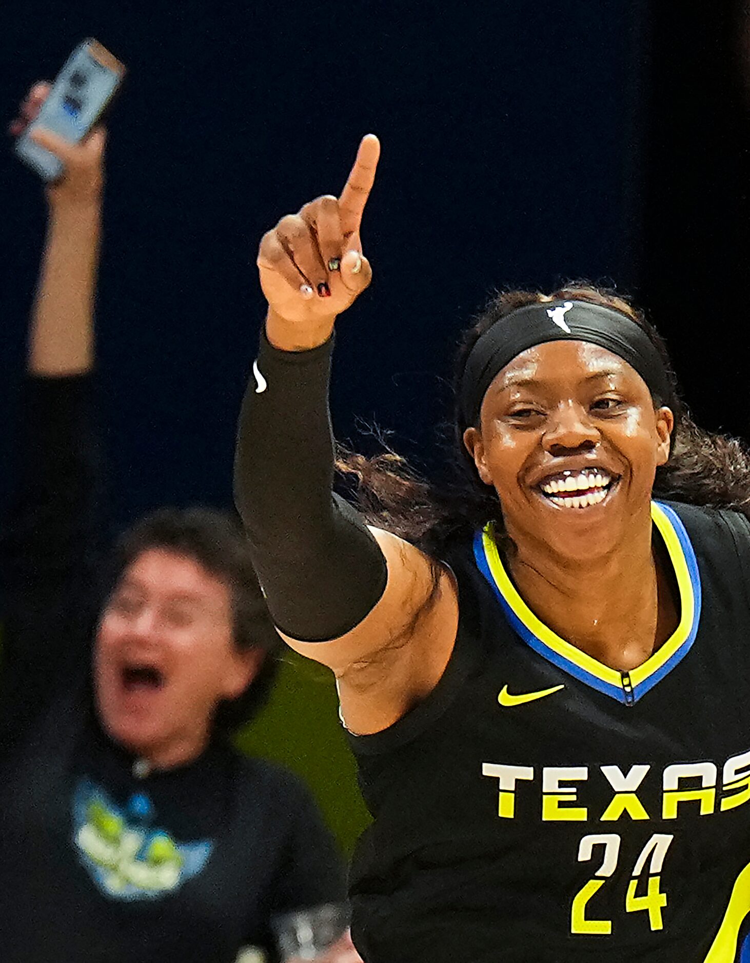 Dallas Wings guard Arike Ogunbowale (24) celebrates after a basket during the first half of...