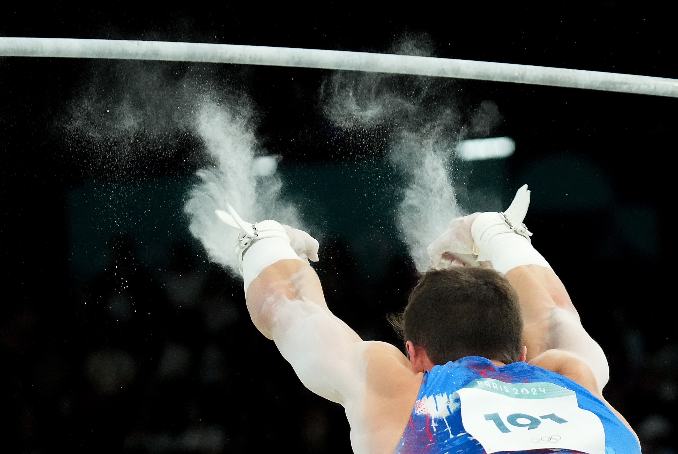 Brody Malone of the United States falls while competing on the high bar during men’s...