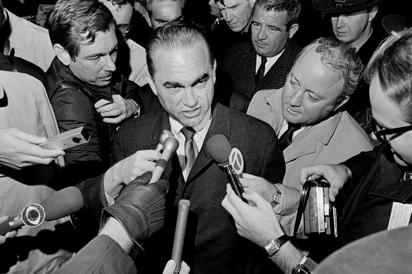 FILE - In this Oct. 29, 1968, file photo, reporters surround presidential candidate, former...
