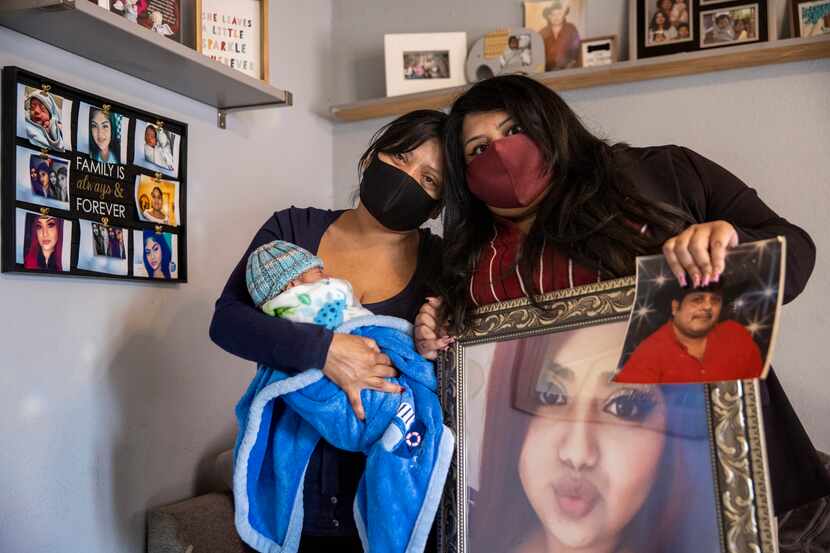 Lucy Palacios (right), 23, holds photos of her deceased sister, Nely, and deceased father,...