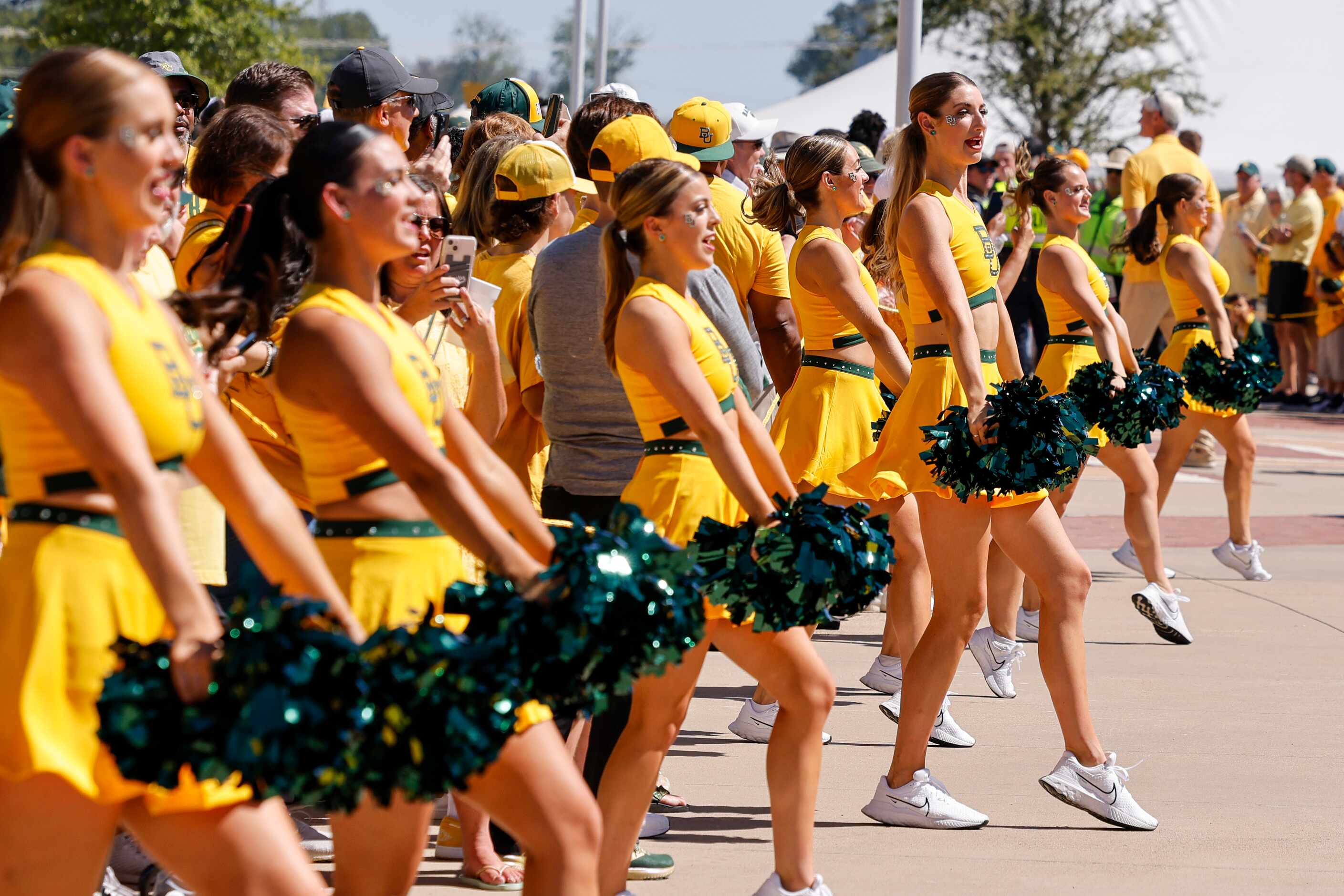 Baylor cheerleaders perform during the Bear Walk before an NCAA football game between Baylor...