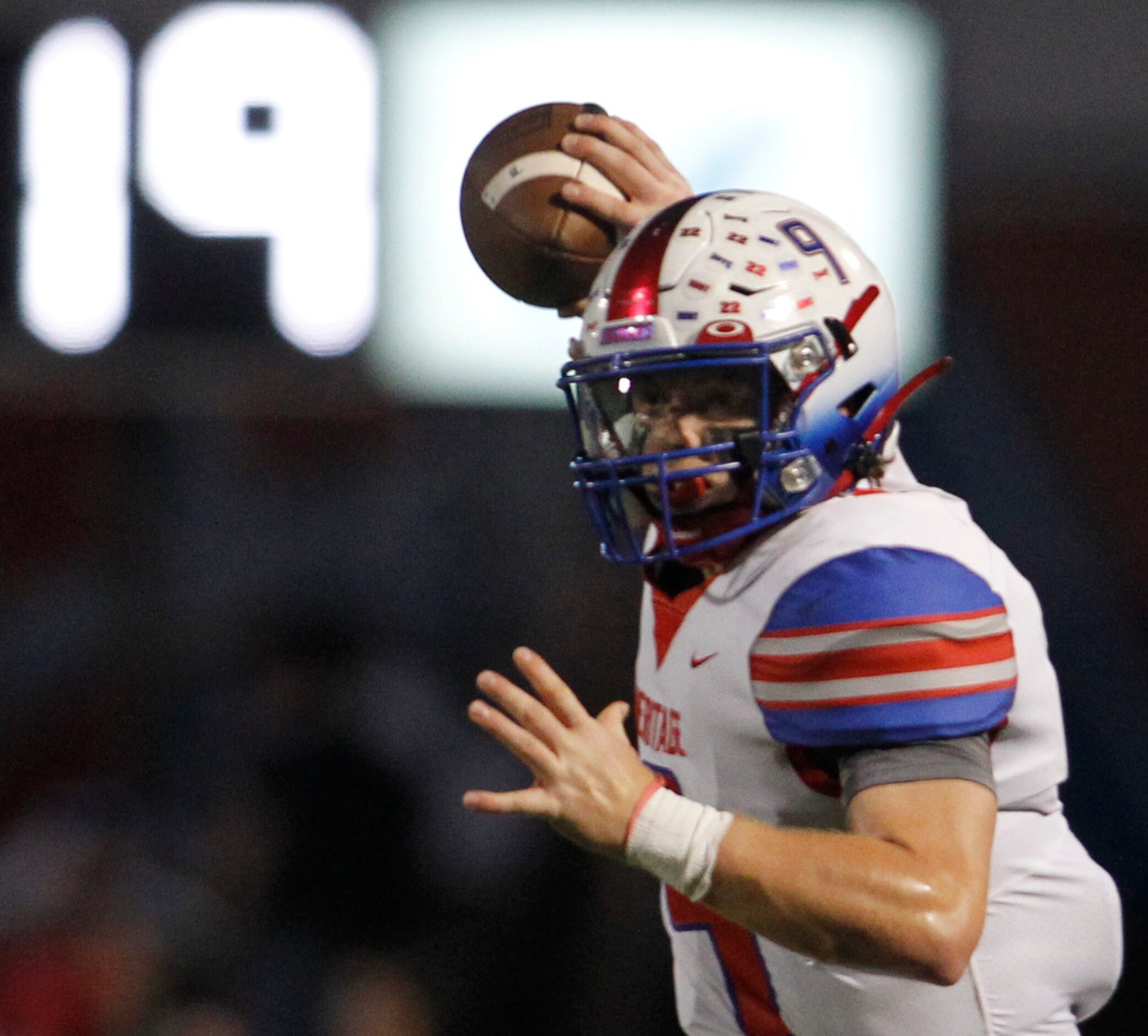 Midlothian Heritage quarterback Carter Rutenbar (9) passes to a receiver during first half...