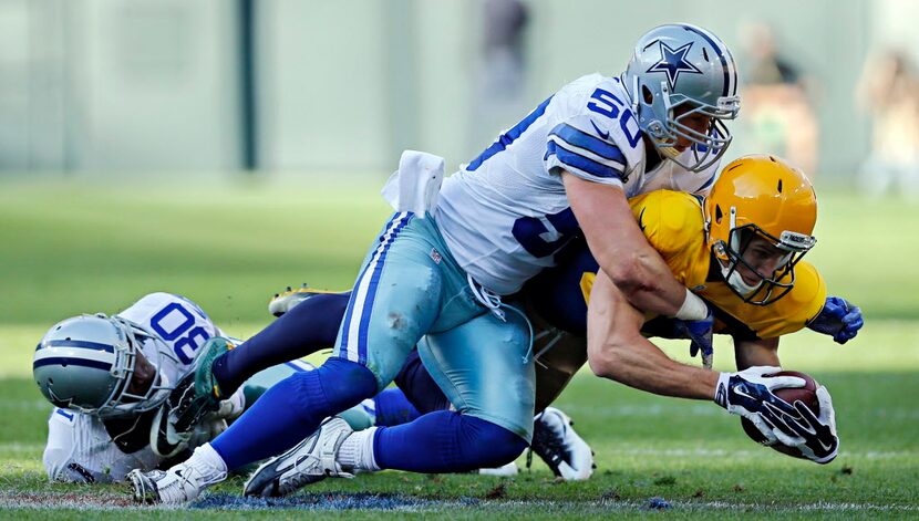 Dallas Cowboys outside linebacker Sean Lee (50) finishes off Green Bay Packers wide receiver...