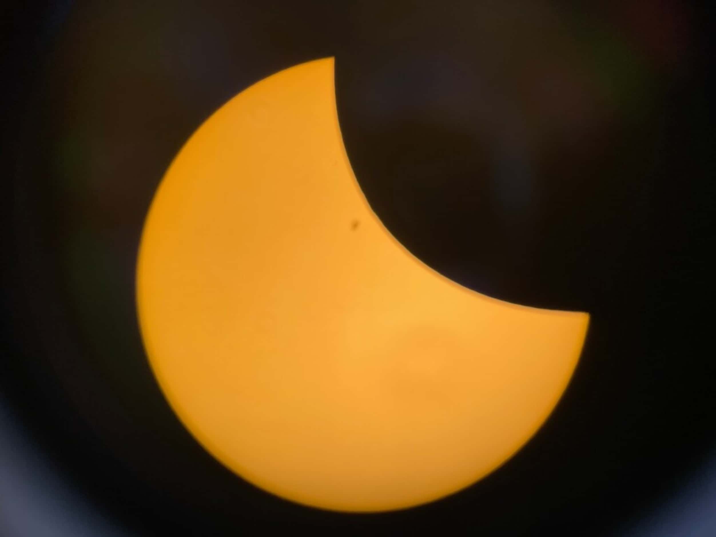 The total solar eclipse is seen through a telescope lens in Midlothian, Texas. Provided by...
