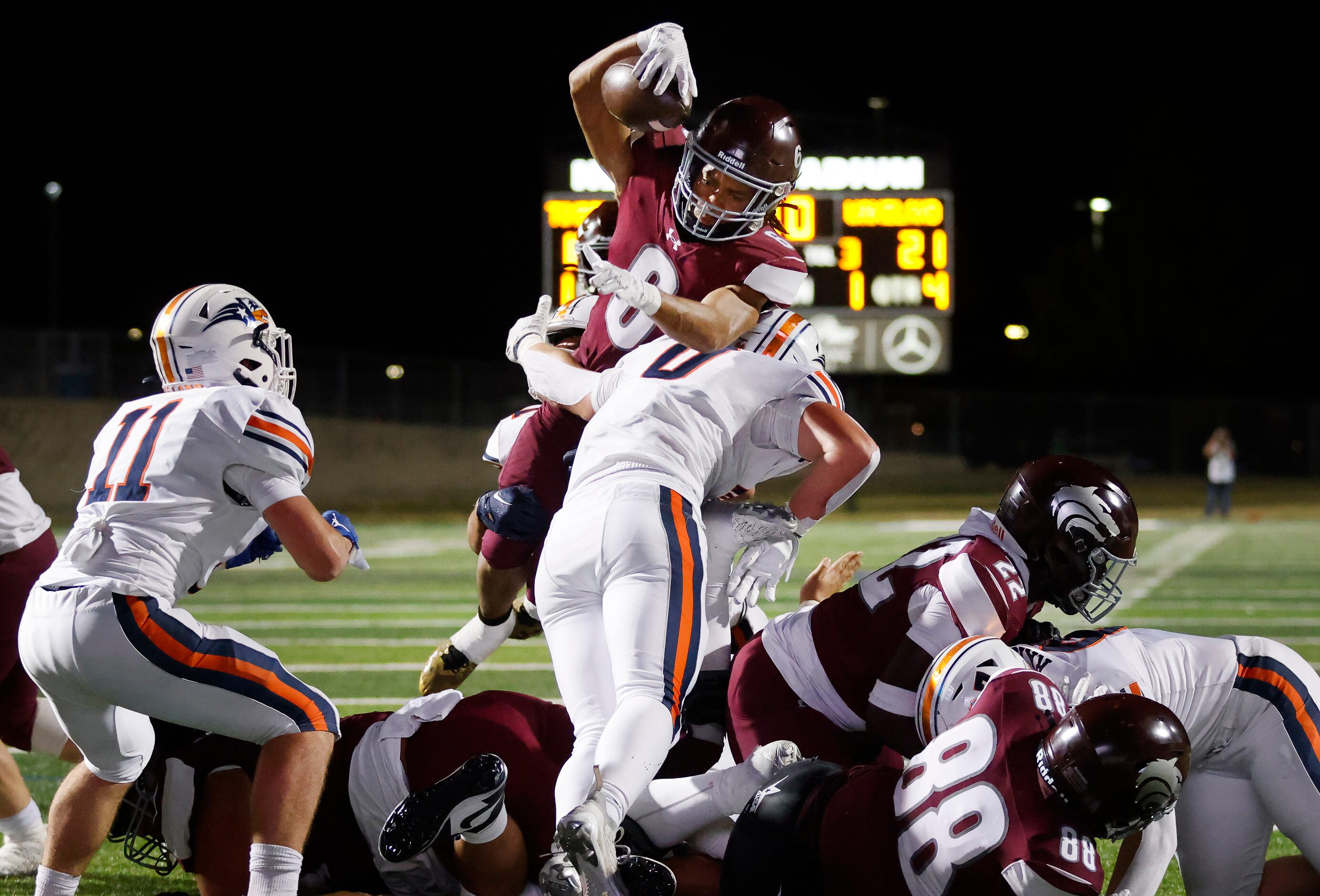 Mansfield Timberview running back Jaylon Woods (6) got over the top for a fourth quarter...