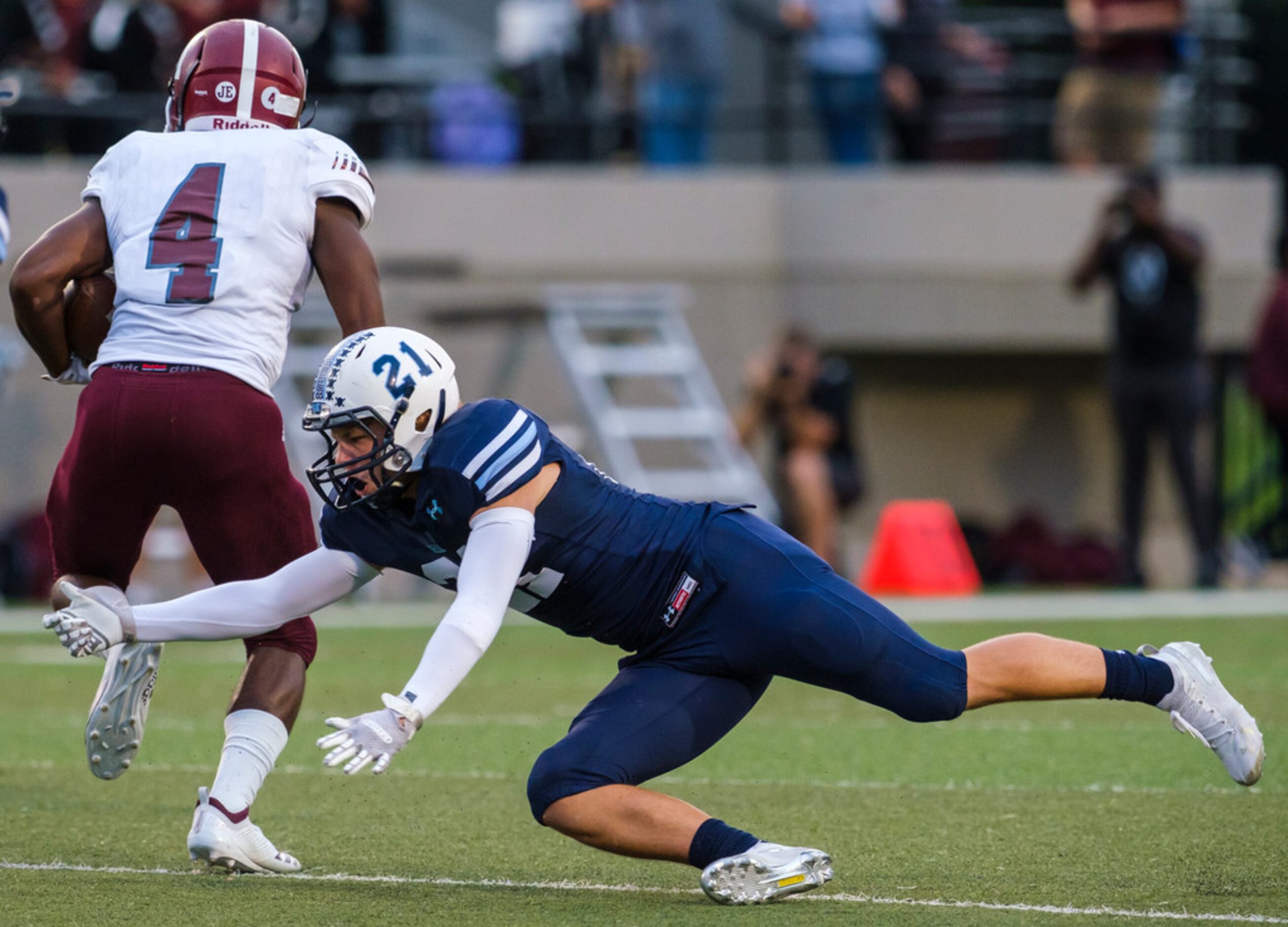 Mesquite running back LaDarius Turner (4) gets past L.D. Bell defensive back Kyle Kamerer...