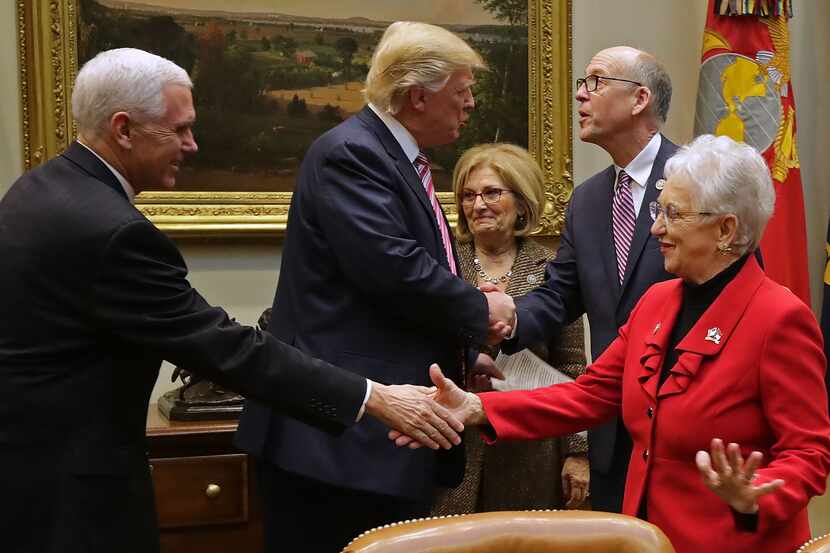 President Donald Trump greets Energy and Commerce Committee Chairman Greg Walden, R-Ore., as...