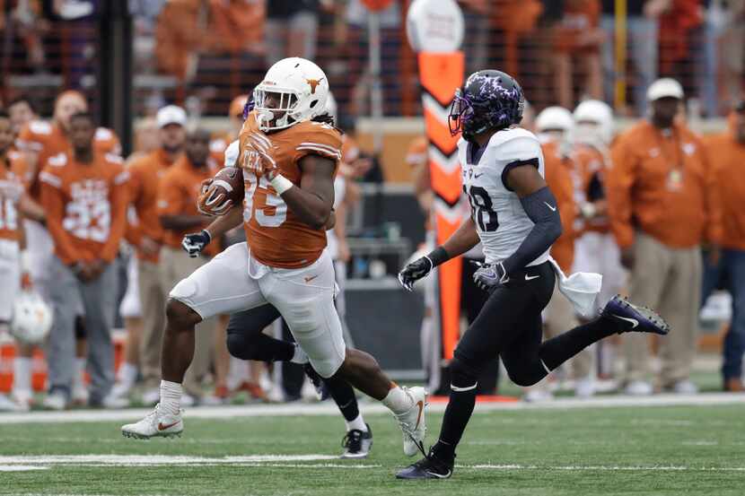 Texas running back D'Onta Foreman (33) runs past TCU safety Nick Orr (18) for 44-yards...