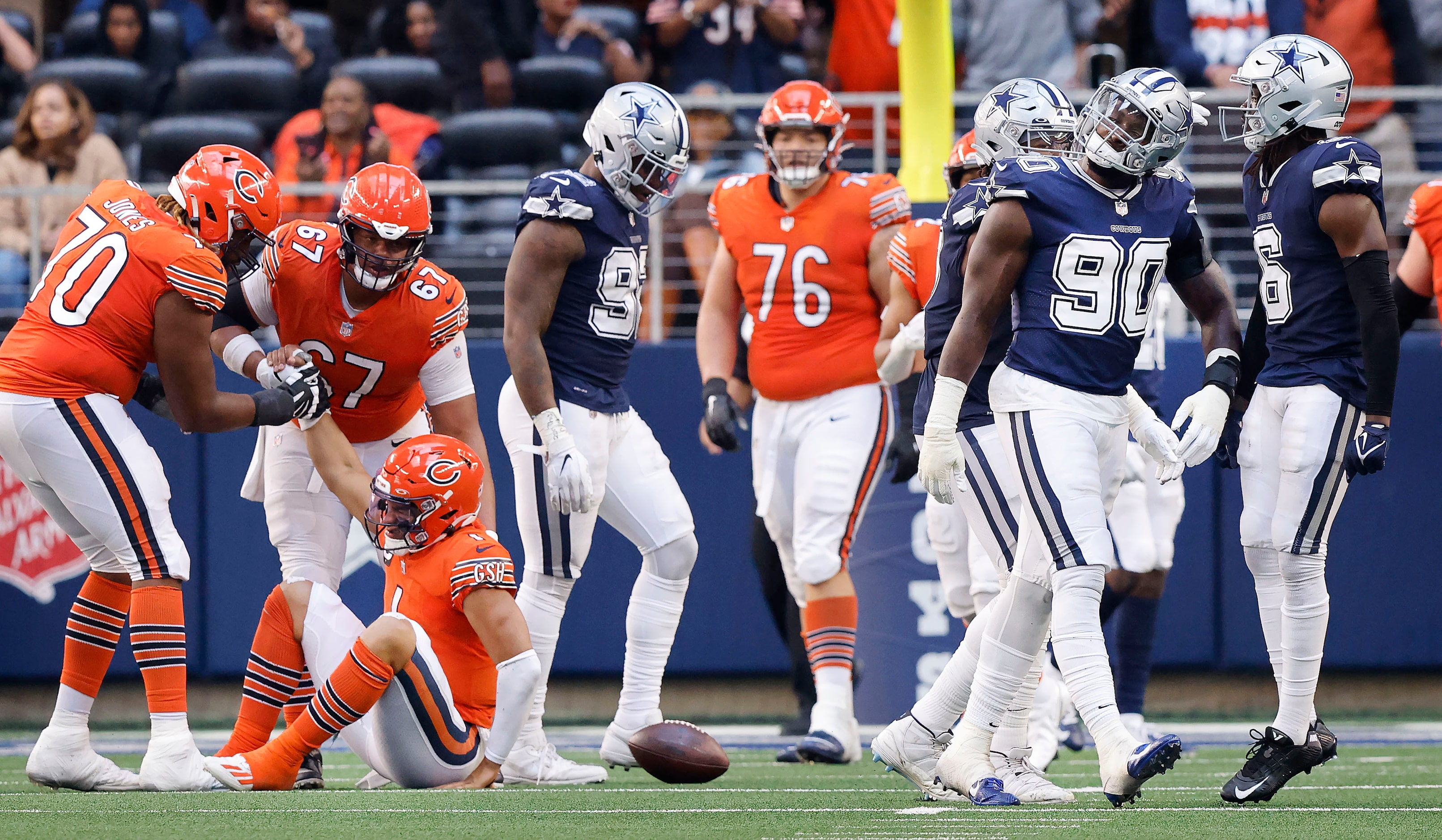 Dallas Cowboys defensive end DeMarcus Lawrence (90) celebrates his bear hug sack of Chicago...