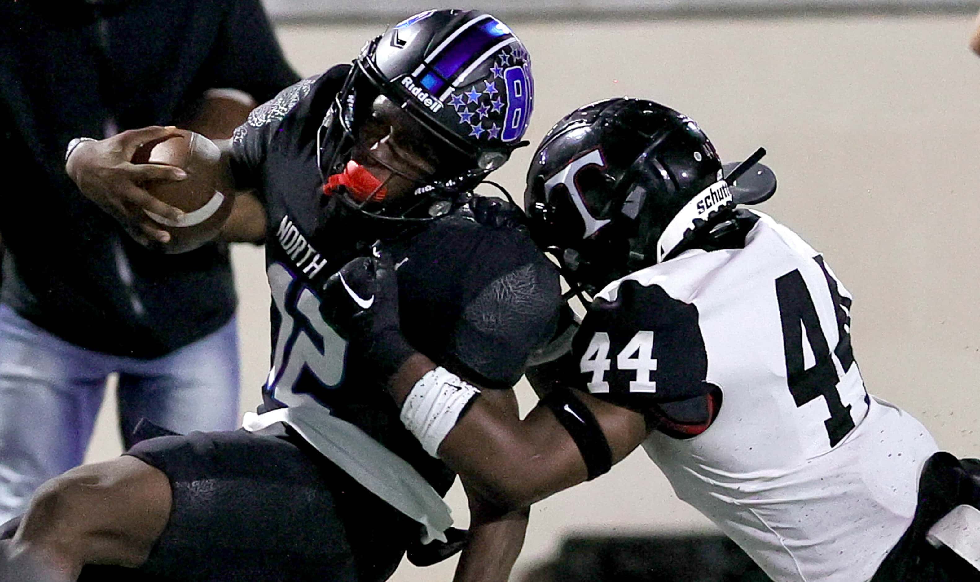 North Crowley quarterback Chris Jimerson Jr. (12) gets forced out of bounds by Euless...