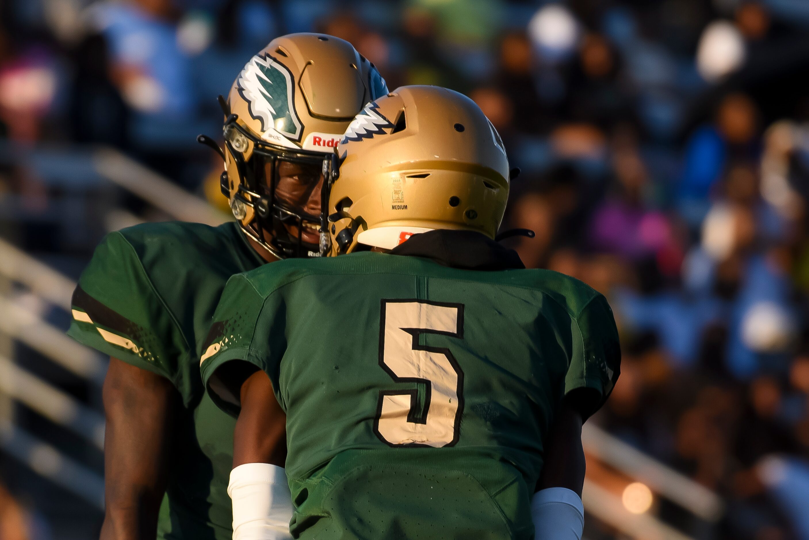 From left, DeSoto senior Johnny Cook II (1) celebrates a huge play with DeSoto senior Tre...