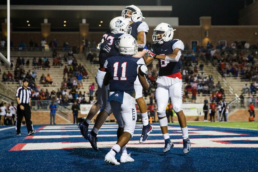 Allen running back Justin Hall (32) celebrates a touchdown with team mates during the fourth...