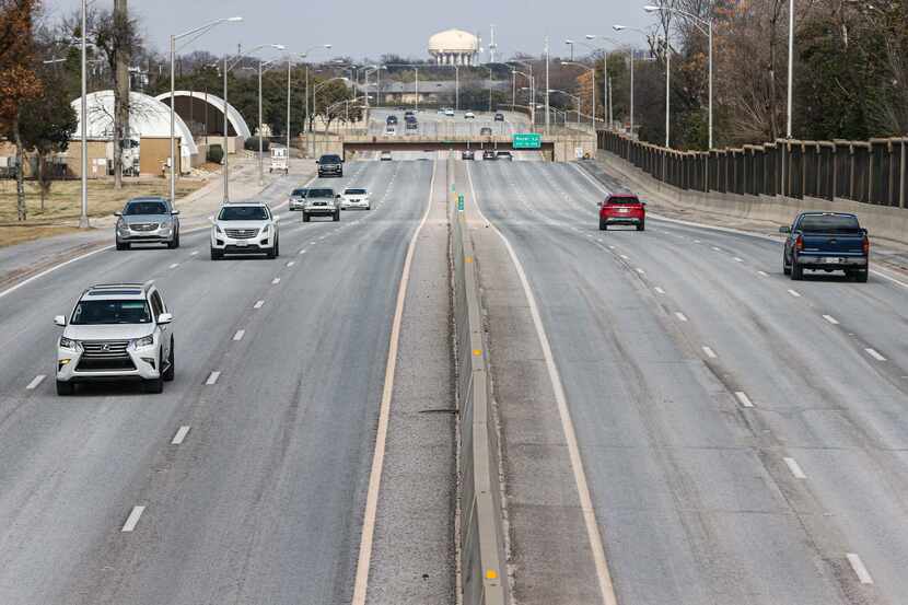 Traffic on Dallas North Tollway under Walnut Hill Lane in Dallas on Saturday, February 13,...