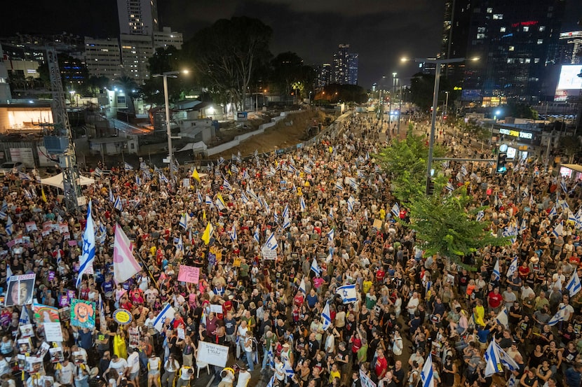 People protest against Prime Minister Benjamin Netanyahu's government and call for the...