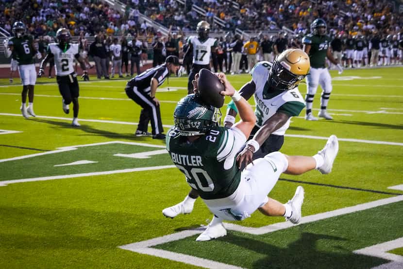 Waxahachie tight end Rhett Butler (20) comes down in the end zone with a touchdown catch as...