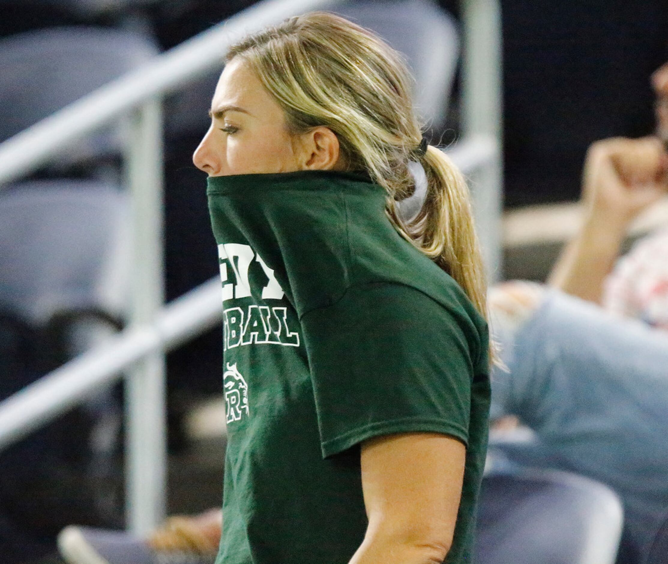 Torrie Naron, wife of the Reedy High School offensive coordinator, reacts and the game...
