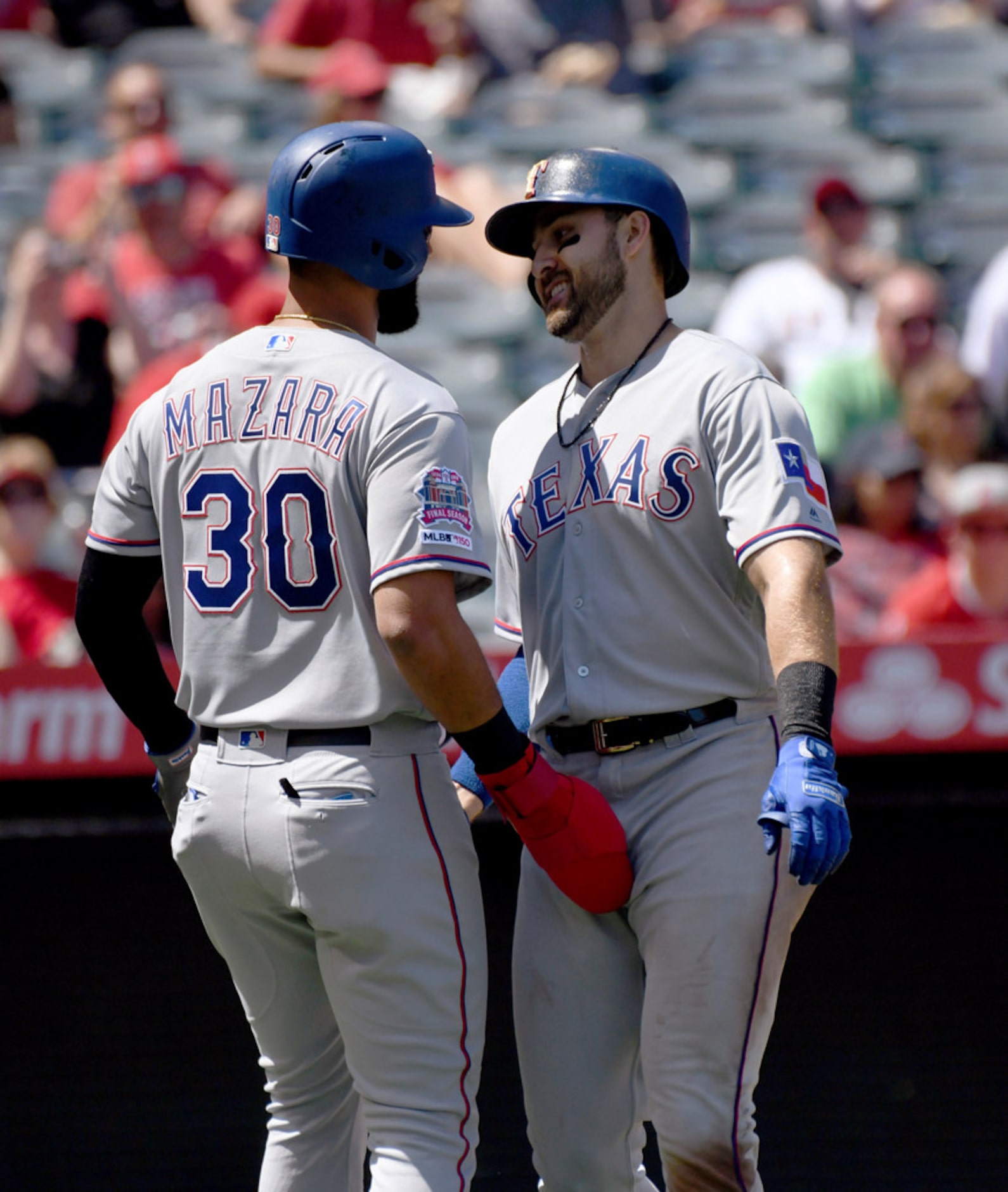 Texas Rangers' Joey Gallo, right, is greeted at home plate by Nomar Mazara after hitting a...