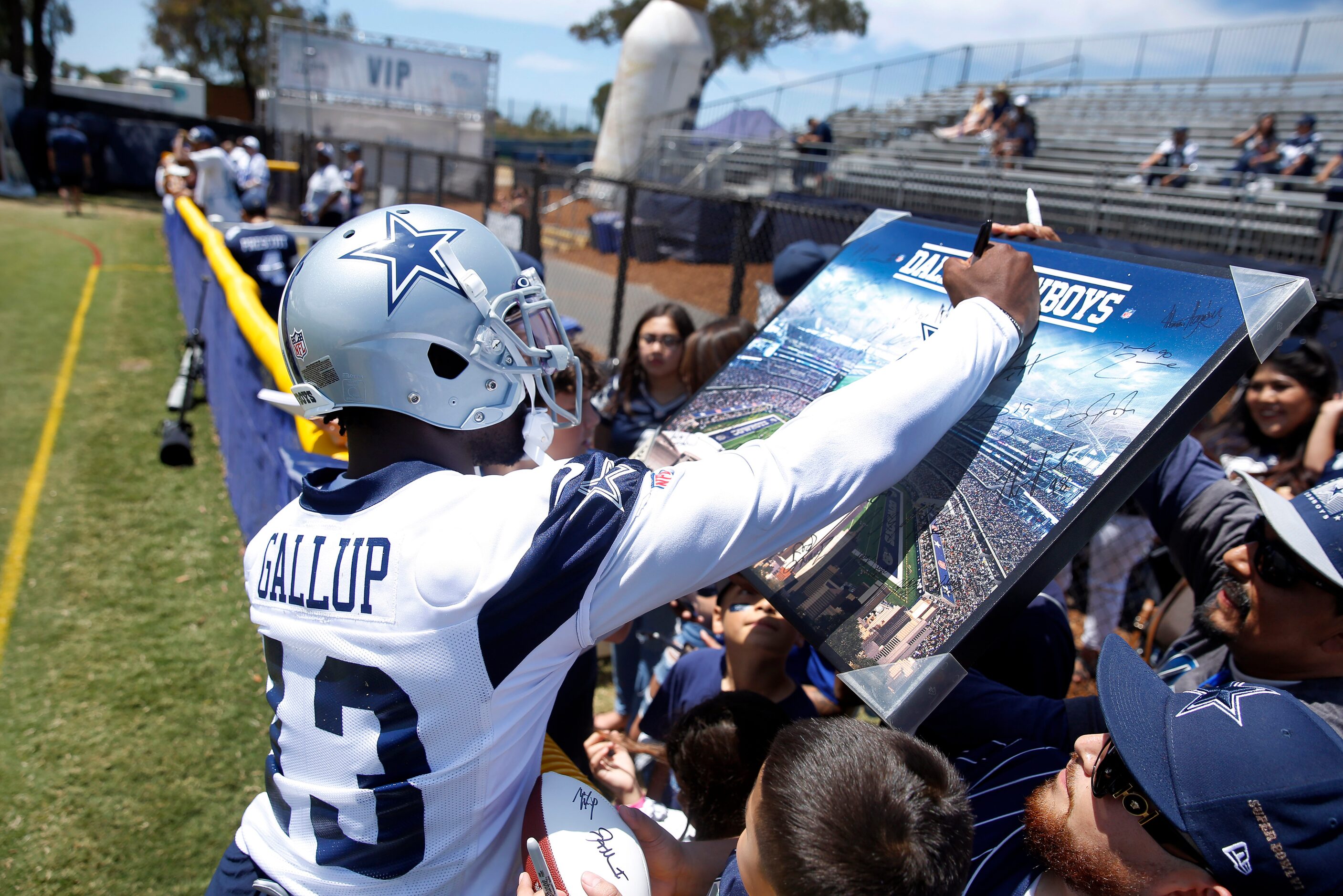 Dallas Cowboys wide receiver Michael Gallup (13) signs autographs for fans following...