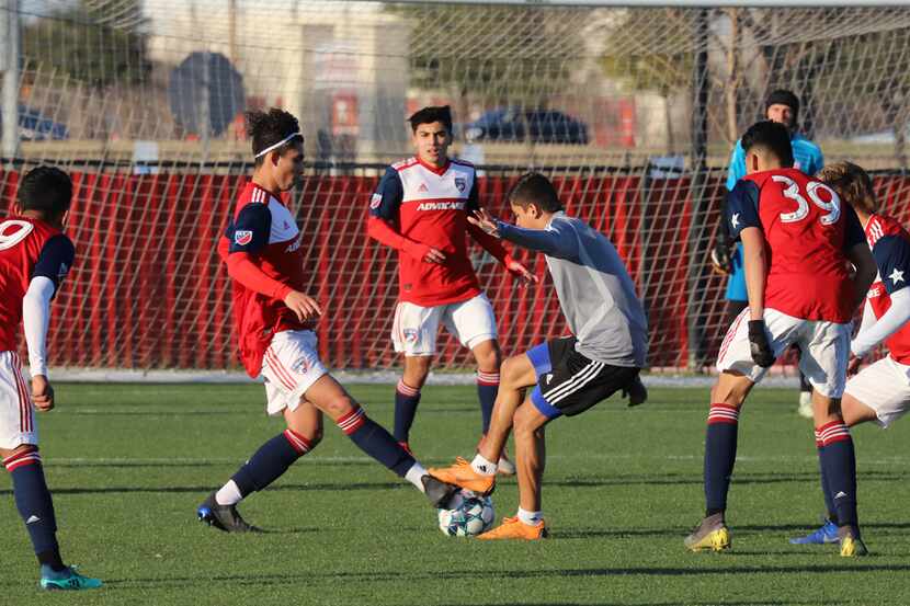 Arturo Rodriguez of North Texas SC is surrounded by FC Dallas Academy U19 players. (3-6-19)