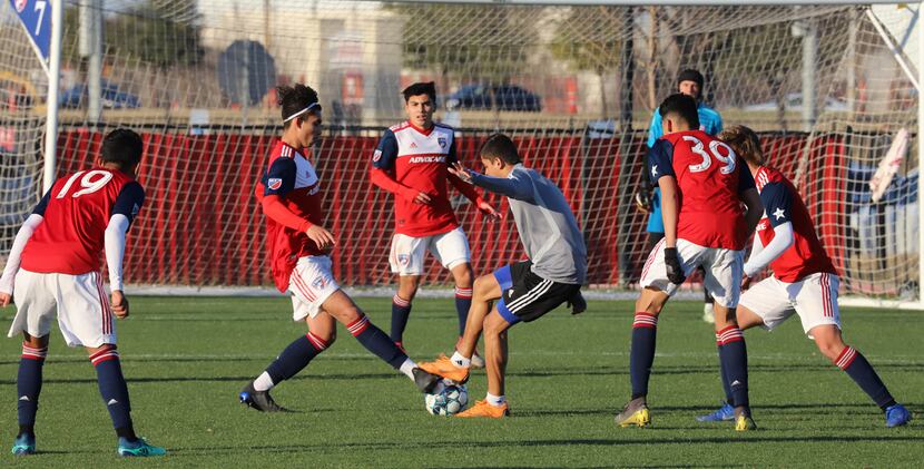 Arturo Rodriguez of North Texas SC is surrounded by FC Dallas Academy U19 players. (3-6-19)
