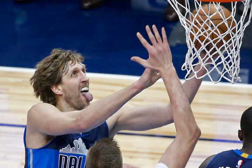 Dallas Mavericks forward Dirk Nowitzki (41) lays up the ball against New York Knicks forward...