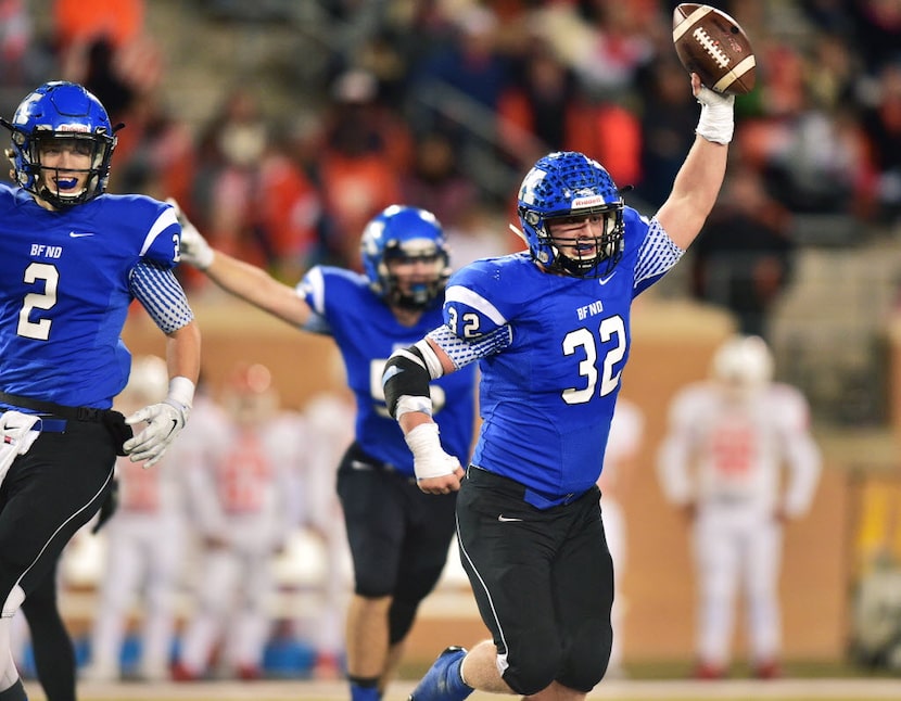 Krum junior linebacker Coleton Spradley (32) comes out with the ball after a turnover...