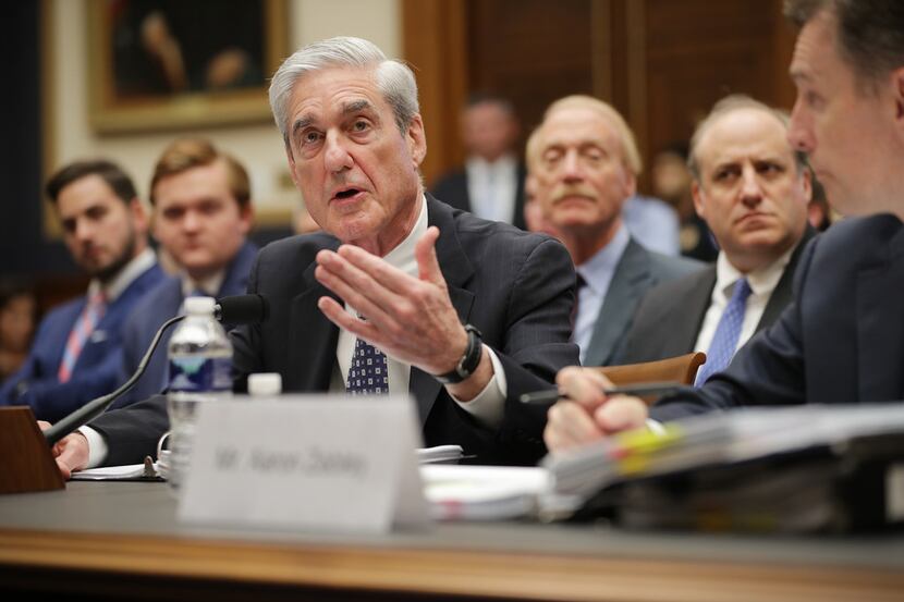 Former special counsel Robert Mueller testifies before the House Intelligence Committee...